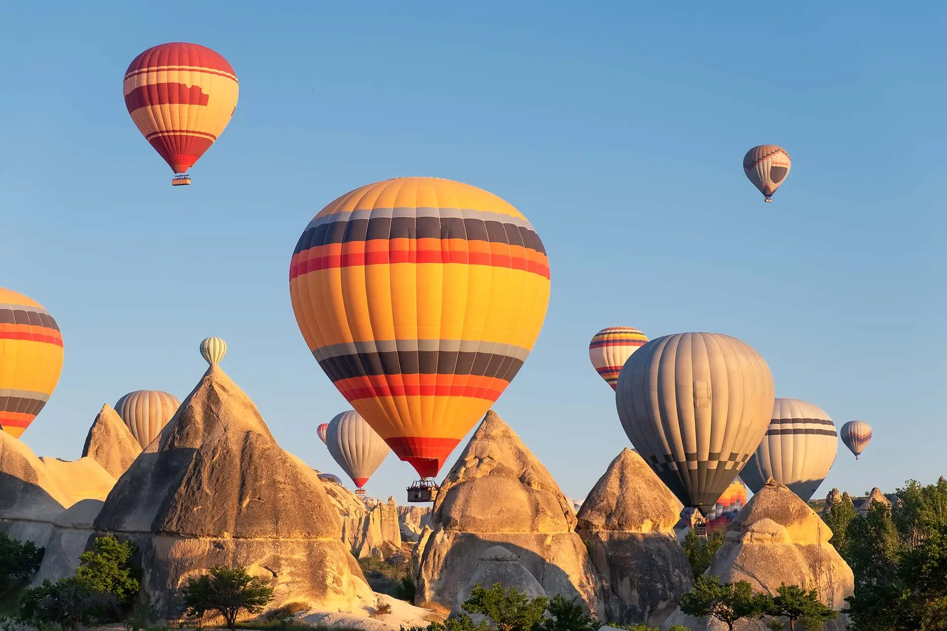 Hot air balloons over the rock formations of Cappadocia