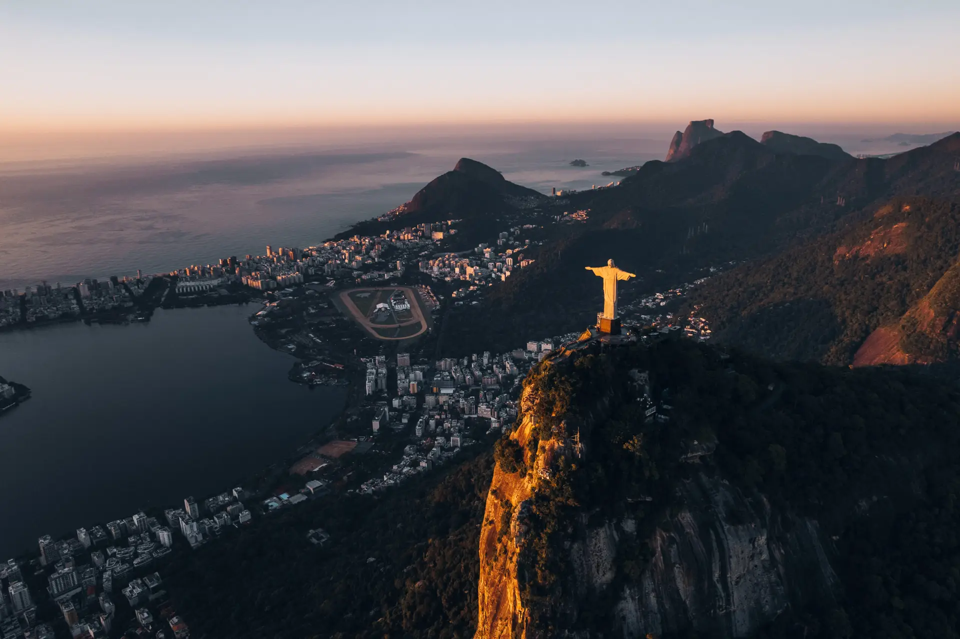 Christ the Redeemer overlooking Rio de Janeiro at sunrise