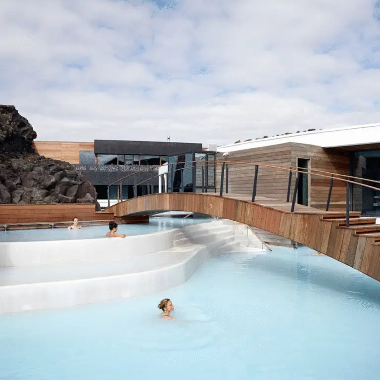 A guest floating peacefully in the Retreat Spa’s secluded lagoon, surrounded by volcanic rock and soothing geothermal steam.