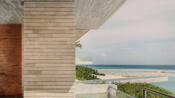 Handwoven hammock suspended over a private terrace pool outside a luxury suite at La Casa de la Playa.