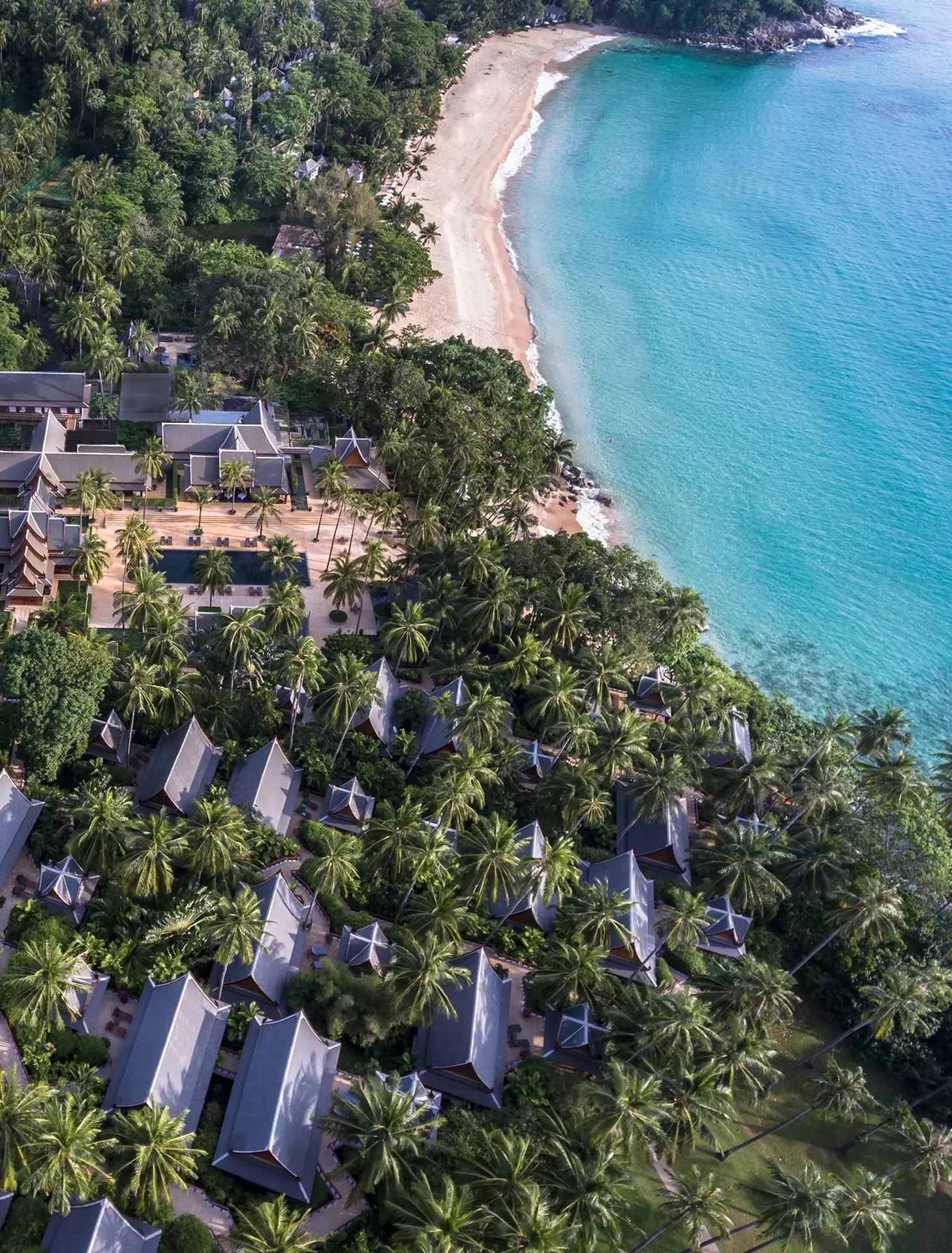 Aerial view of Amanpuri Phuket luxury resort set on a private peninsula overlooking the Andaman Sea.